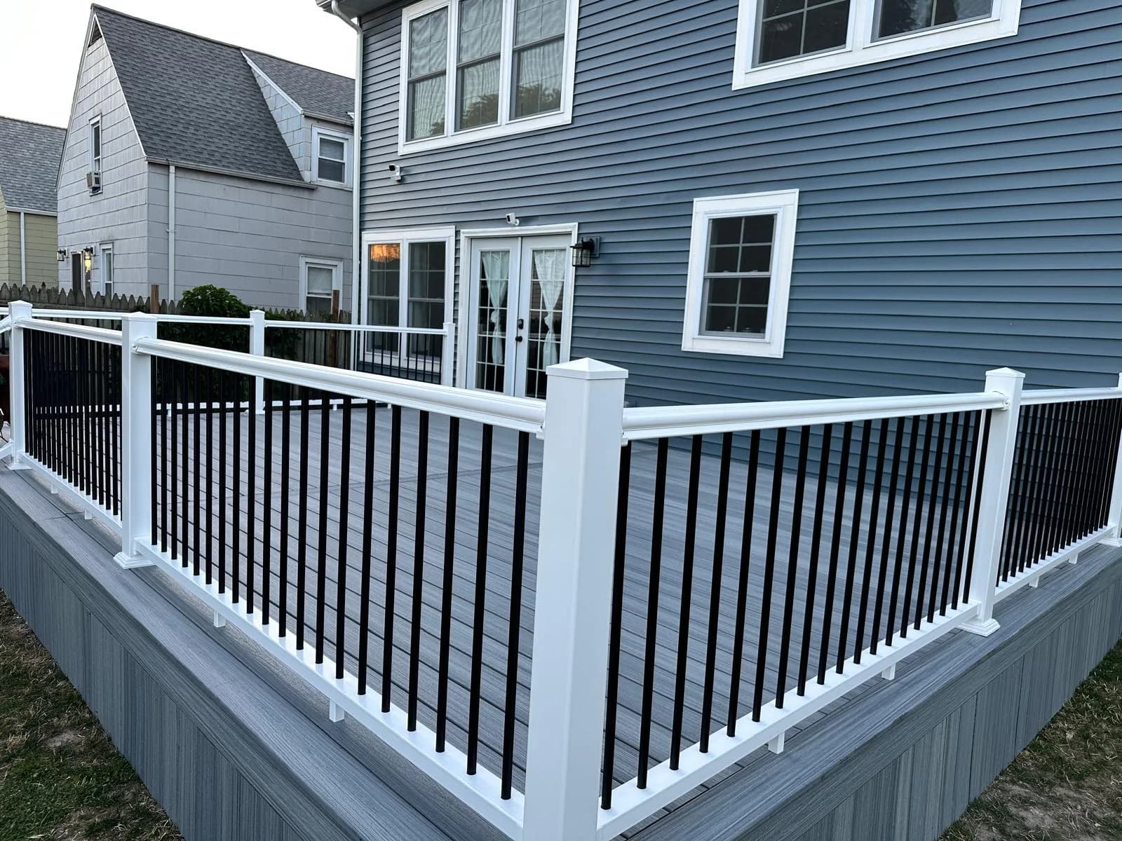 Composite deck black railing close-up — Buffalo NY