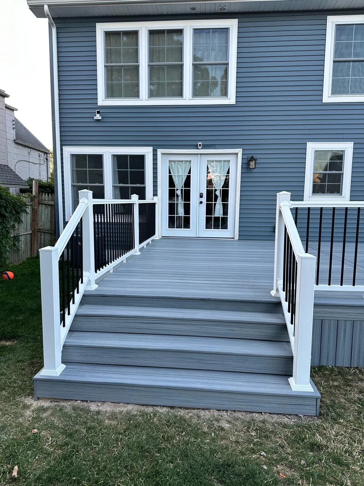 Multi-level deck stairs side view — Buffalo NY