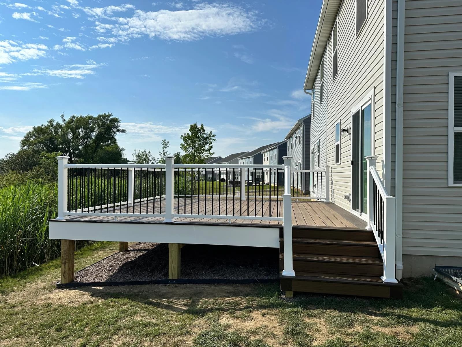 Raised composite deck with black aluminum railing — Buffalo NY