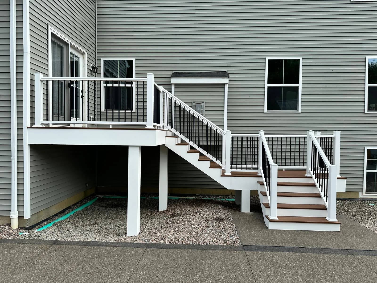 Raised deck black railing staircase — Buffalo NY